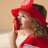 Child holding the walkie talkie from the PlanToys fire fighter play set