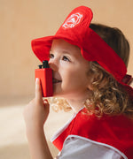 Child holding the walkie talkie from the PlanToys fire fighter play set