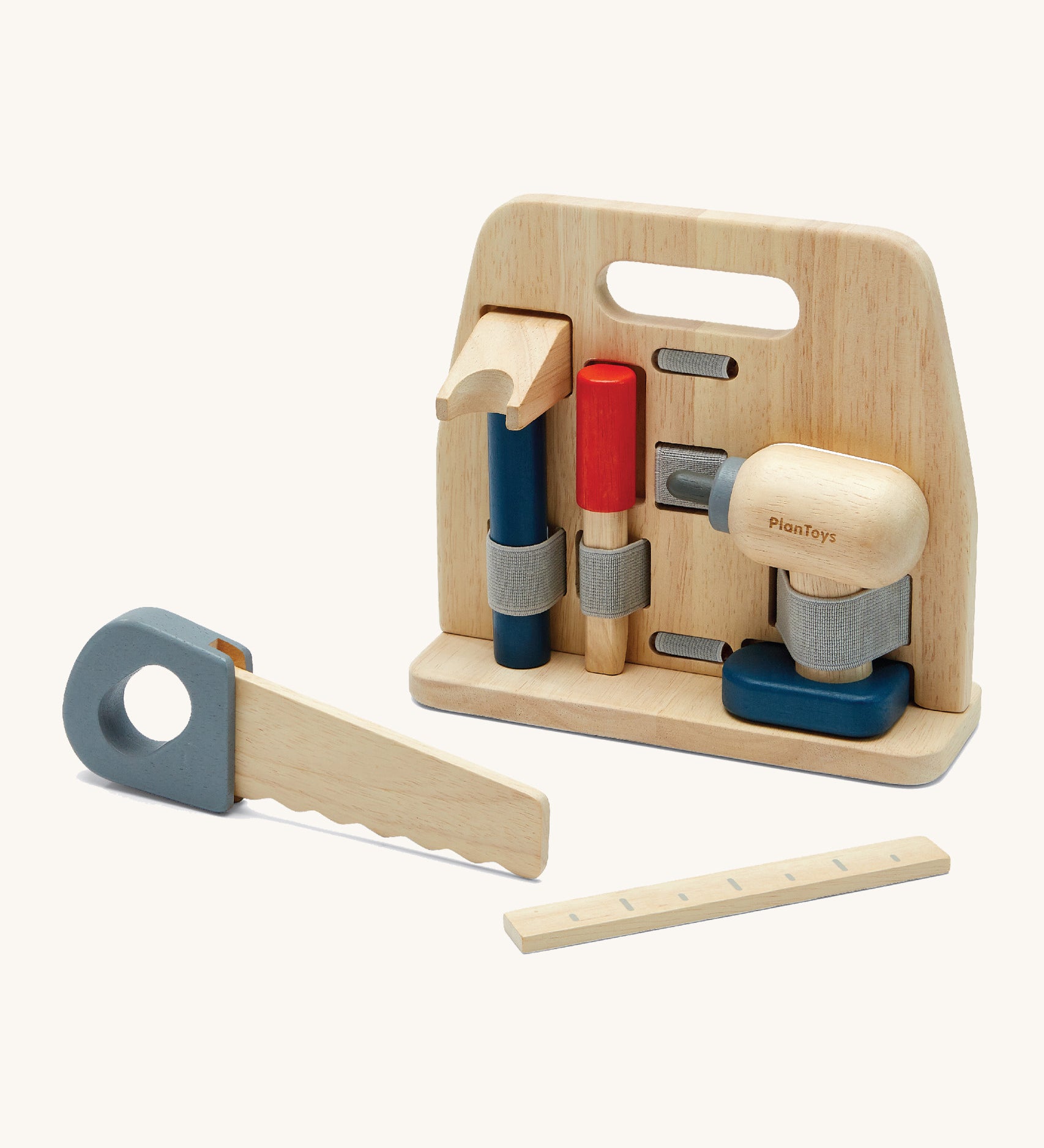 Plan Toys wooden handy carpenter set available at Babipur. Set including a saw, drill, chisel, claw hammer, ruler and a wooden tool stand. Each tool is held by an elasticated fabric band.