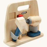 A side image of the Plan Toys wooden handy carpenter set available at Babipur, showing the claw hammer, chisel and drill held on the tool stand