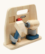 A side image of the Plan Toys wooden handy carpenter set available at Babipur, showing the claw hammer, chisel and drill held on the tool stand