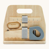 A back image of the Plan Toys wooden handy carpenter set available at Babipur showing a closer look at the ruler and saw on the tool stand.