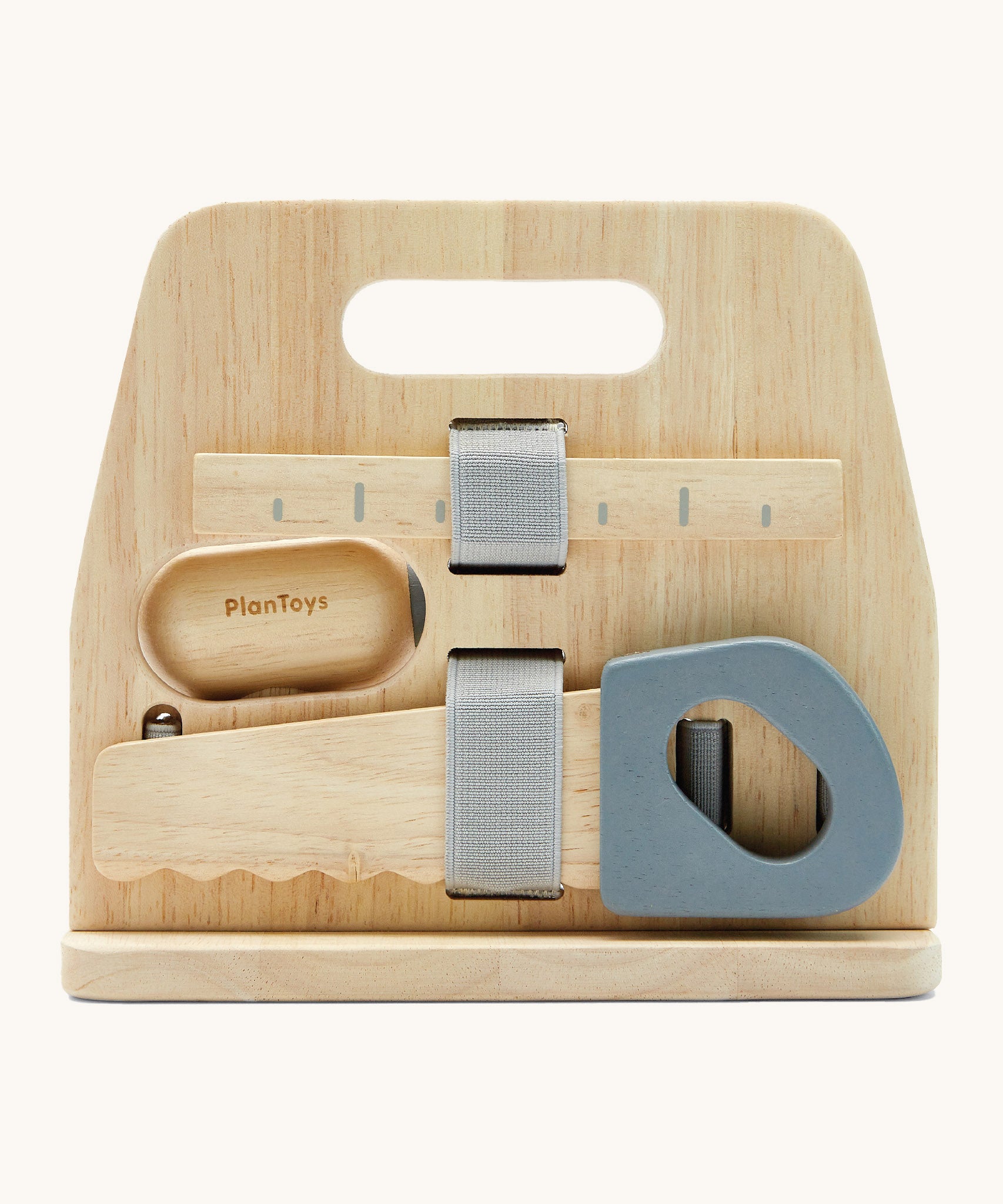 A back image of the Plan Toys wooden handy carpenter set available at Babipur showing a closer look at the ruler and saw on the tool stand.