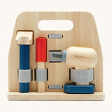 A front image of the Plan Toys wooden handy carpenter set available at Babipur showing a closer look at the hammer, chisel and drill on the tool stand.