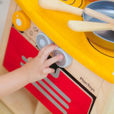 PlanToys kitchen set showing a close up of the working knobs and oven door
