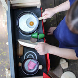 Overhead view of a kitchen setup with play food on the PlanToys Play centre