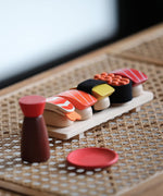 PlanToys wooden sushi play set standing on a table