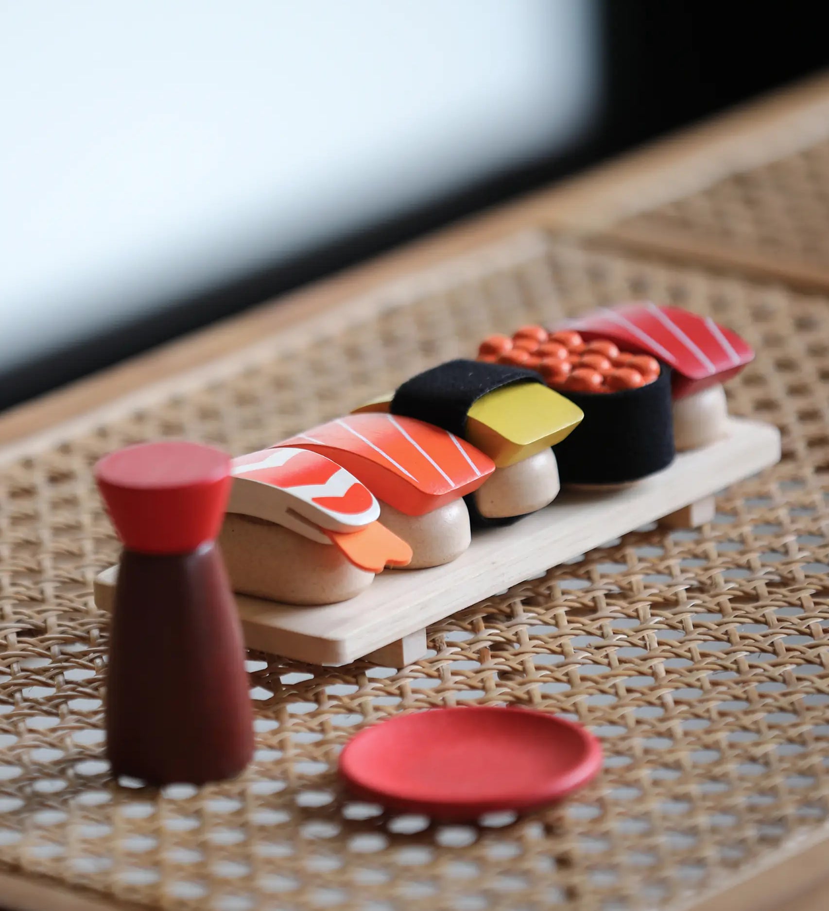 PlanToys wooden sushi play set standing on a table