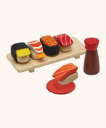 PlanToys wooden sushi play set. Includes a serving board, sauce and  play food pieces