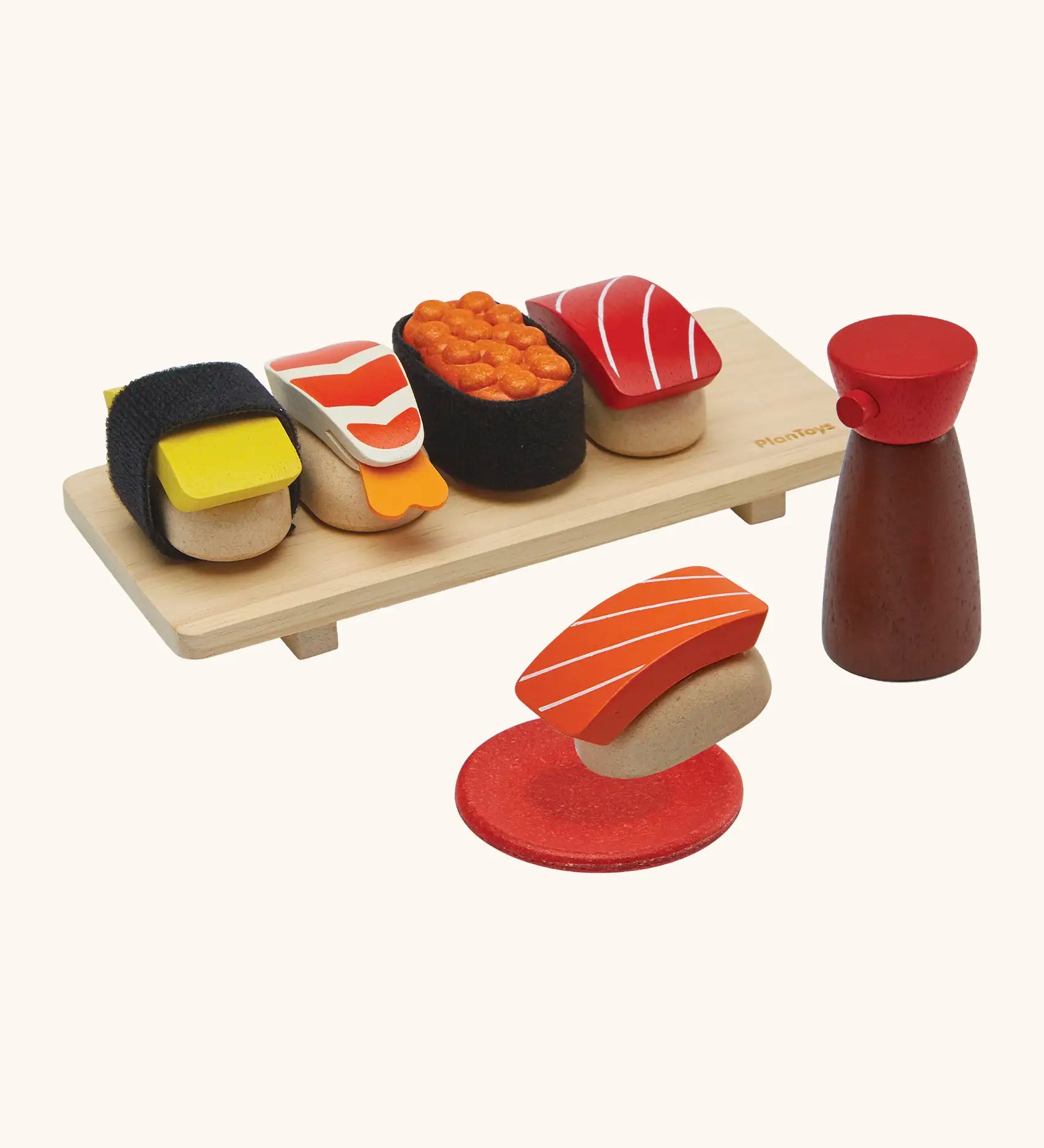 PlanToys wooden sushi play set. Includes a serving board, sauce and  play food pieces
