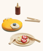 PlanToys wooden waffle play set. Includes a maker, sauce, cutlery and play food pieces