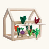 PlanToys wooden blooming greenhouse from the build a garden range. Set includes a frame, different veg and sorting pieces