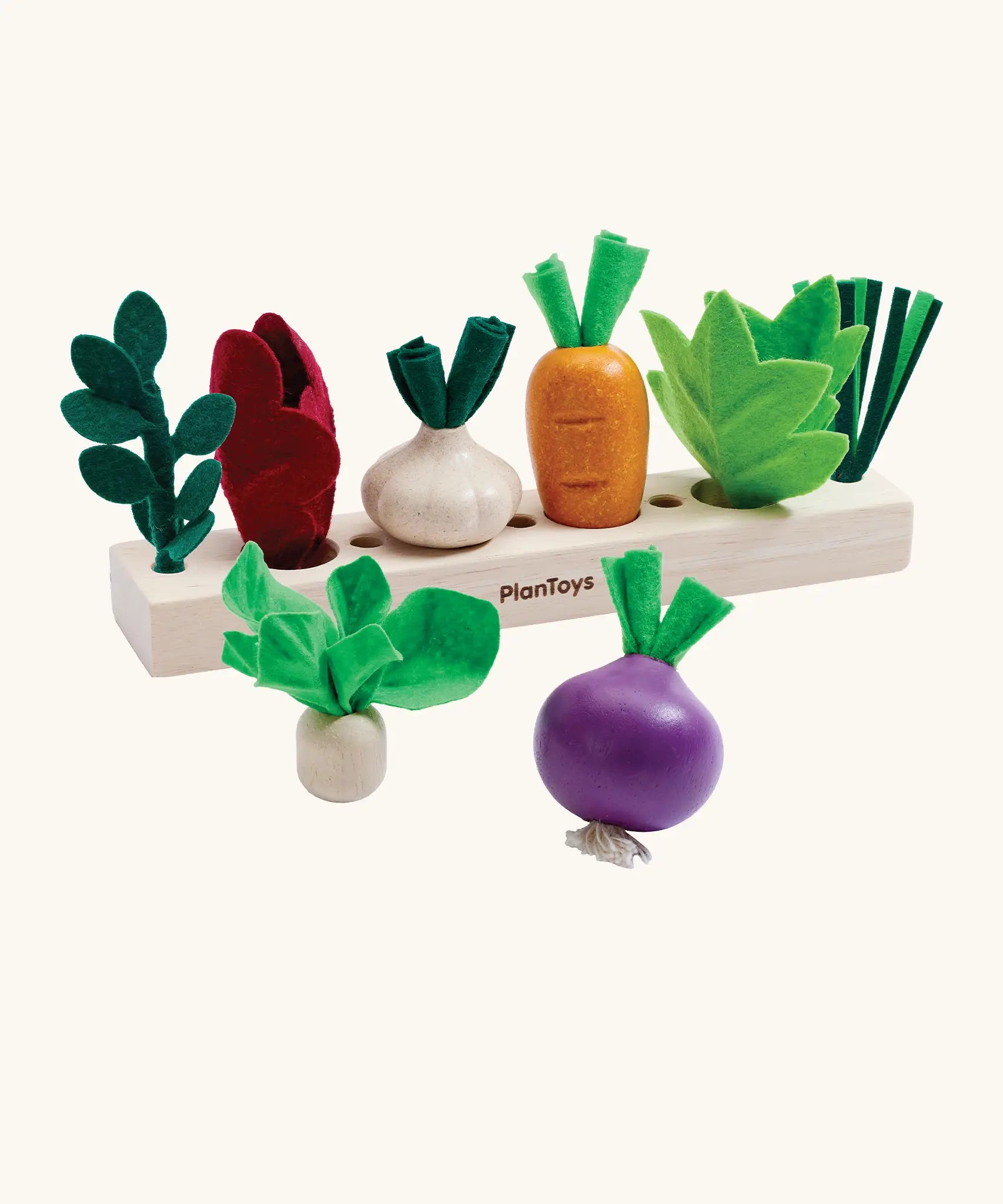 PlanToys wooden seedling patch set showing loose veg sitting on top of planting bed.
