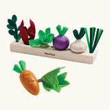 PlanToys wooden seedling patch set from the build a garden set. Includes loose veg pieces and a planting bed