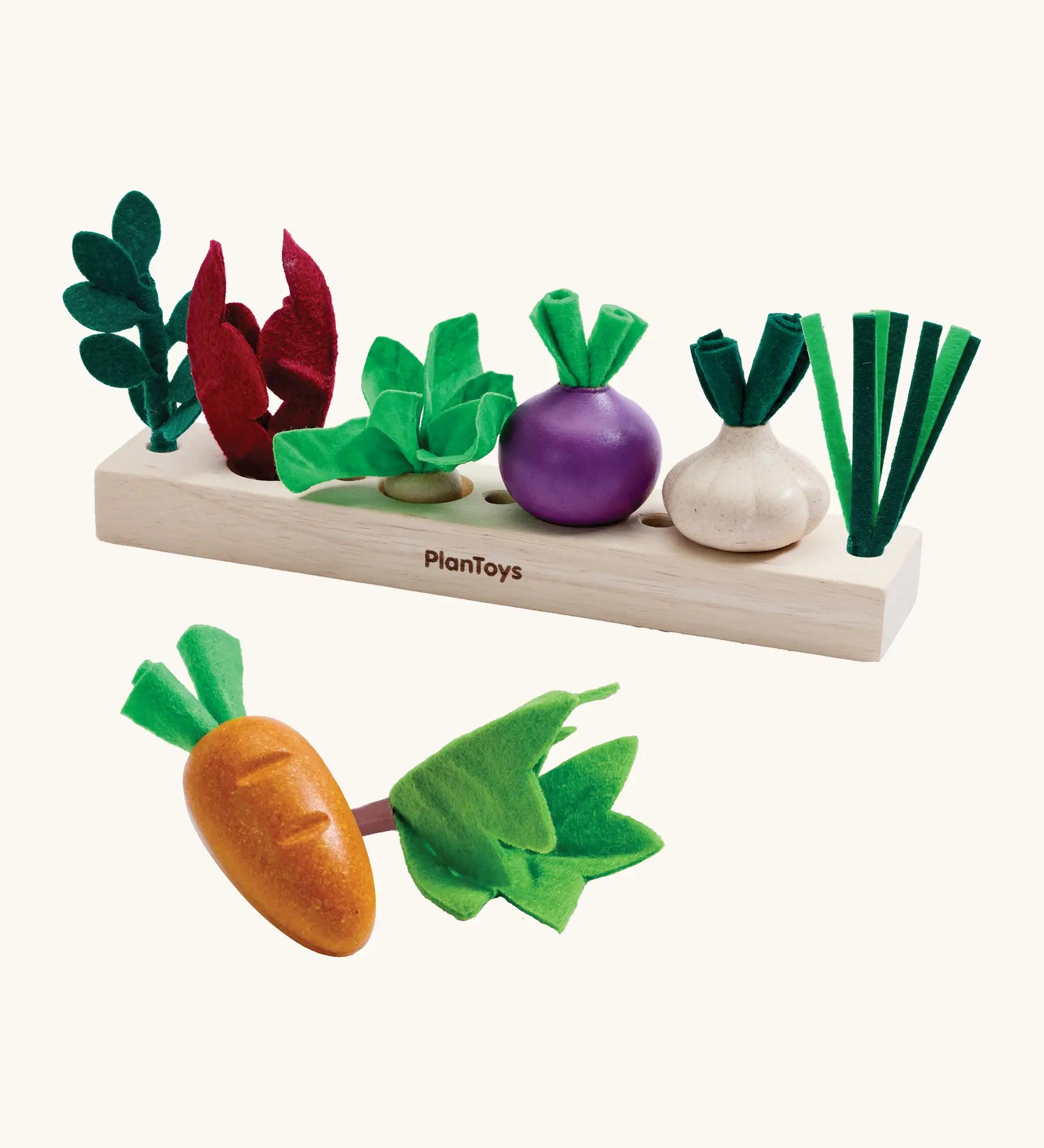 PlanToys wooden seedling patch set from the build a garden set. Includes loose veg pieces and a planting bed