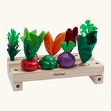 PlanToys stack & sprout set from the build a garden range. Comes with different veg pieces and 2 wooden sorting planters