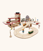 PlanToys city transit with rail and road playset. Includes wooden road and rail pieces, train station, vehicles and a carpark