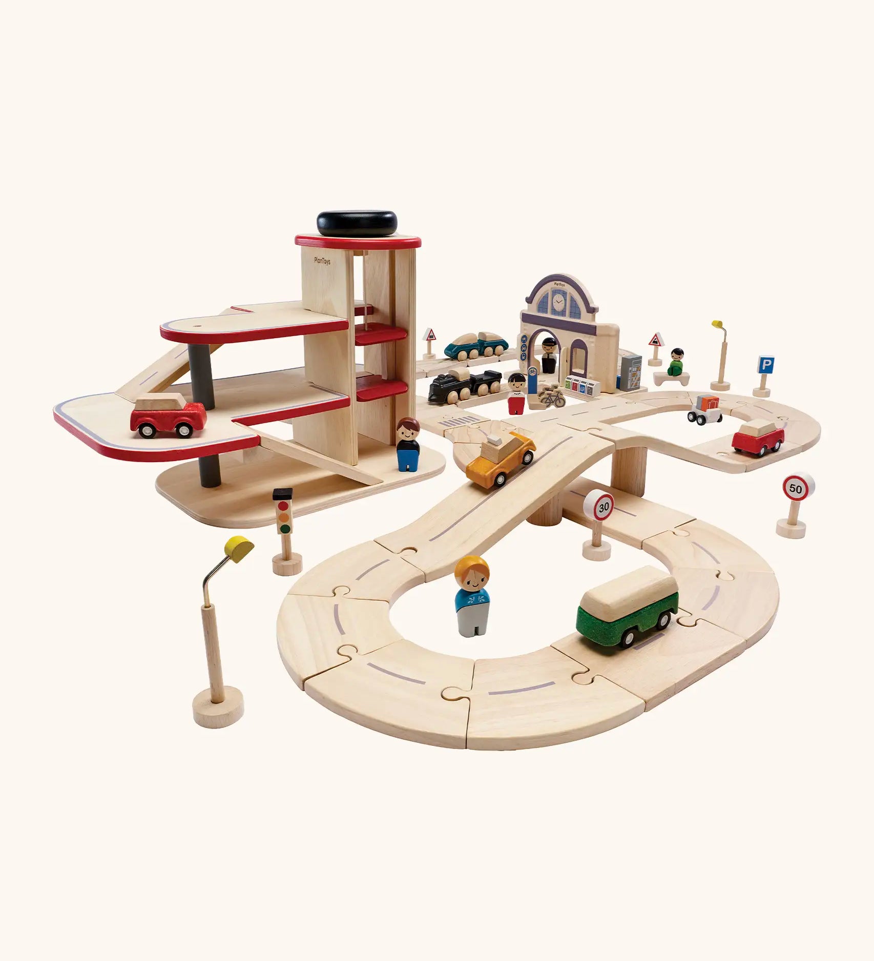 PlanToys city transit with rail and road playset. Includes wooden road and rail pieces, train station, vehicles and a carpark