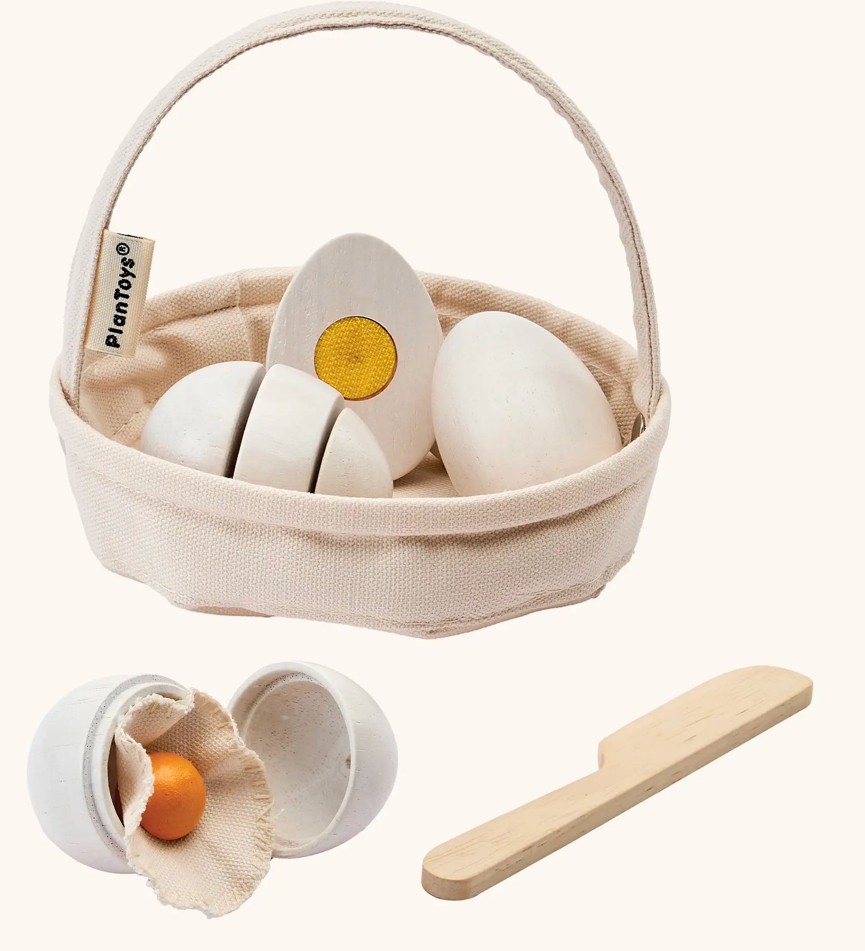 PlanToys crack & cook egg basket set. Features 3 eggs to cut and a wooden knife