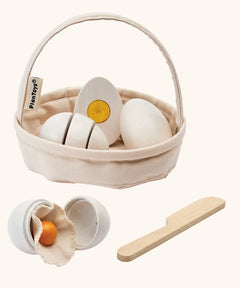 PlanToys crack & cook egg basket set. Features 3 eggs to cut and a wooden knife