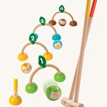 PlanToys Croquet is a fun and colourful game of skill, but can also be used as a colour match and counting game. The set comes with two wooden rackets, 4 balls that each have a face of an animal (monkey, penguin, tiger and frog), and 4 semi circle, rope hoops each with a number 1 to 4 on top, for the ball to go through. The image is on a cream background
