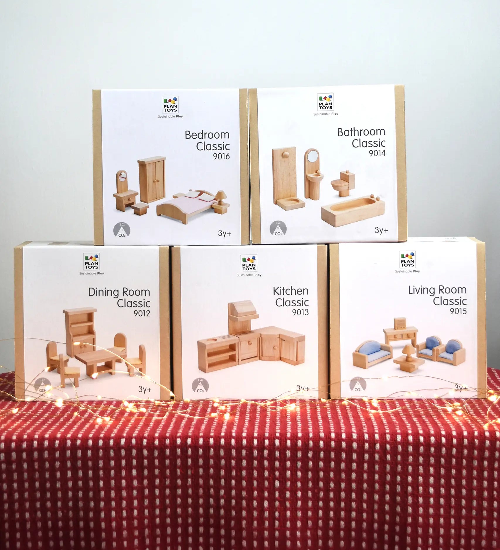 PlanToys wooden dolls house furniture set, includes bedroom, bathroom, dining room, kitchen and living room for the Victorian dollhouse.