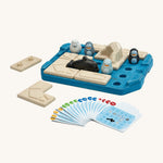 Plan toys eco-friendly wooden finding penguin childrens board game laid out on a cream background