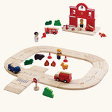 PlanToys fire & rescue roadway set. Features wooden road pieces, emergency vehicles and figures and a fire station set