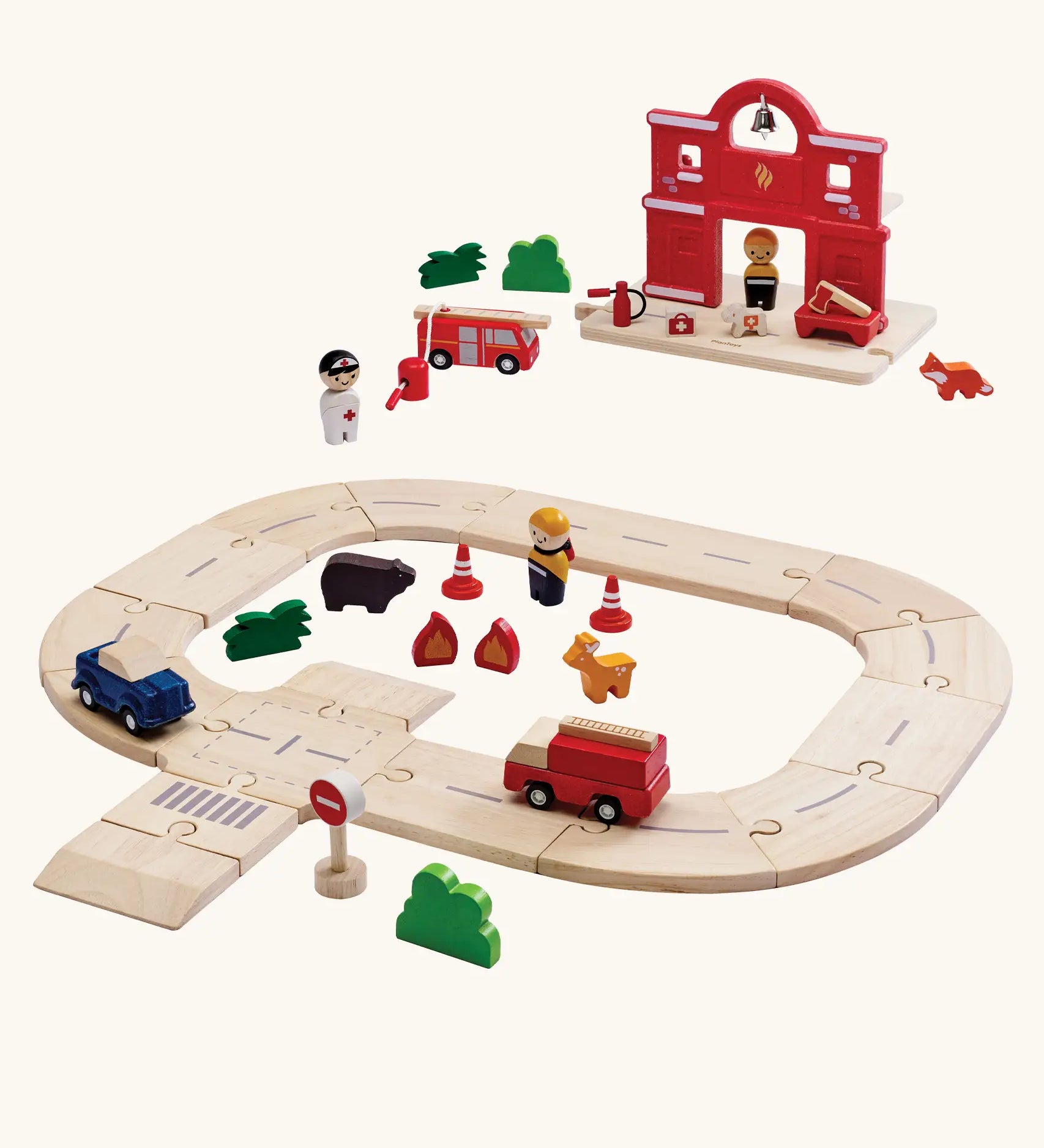 PlanToys fire & rescue roadway set. Features wooden road pieces, emergency vehicles and figures and a fire station set