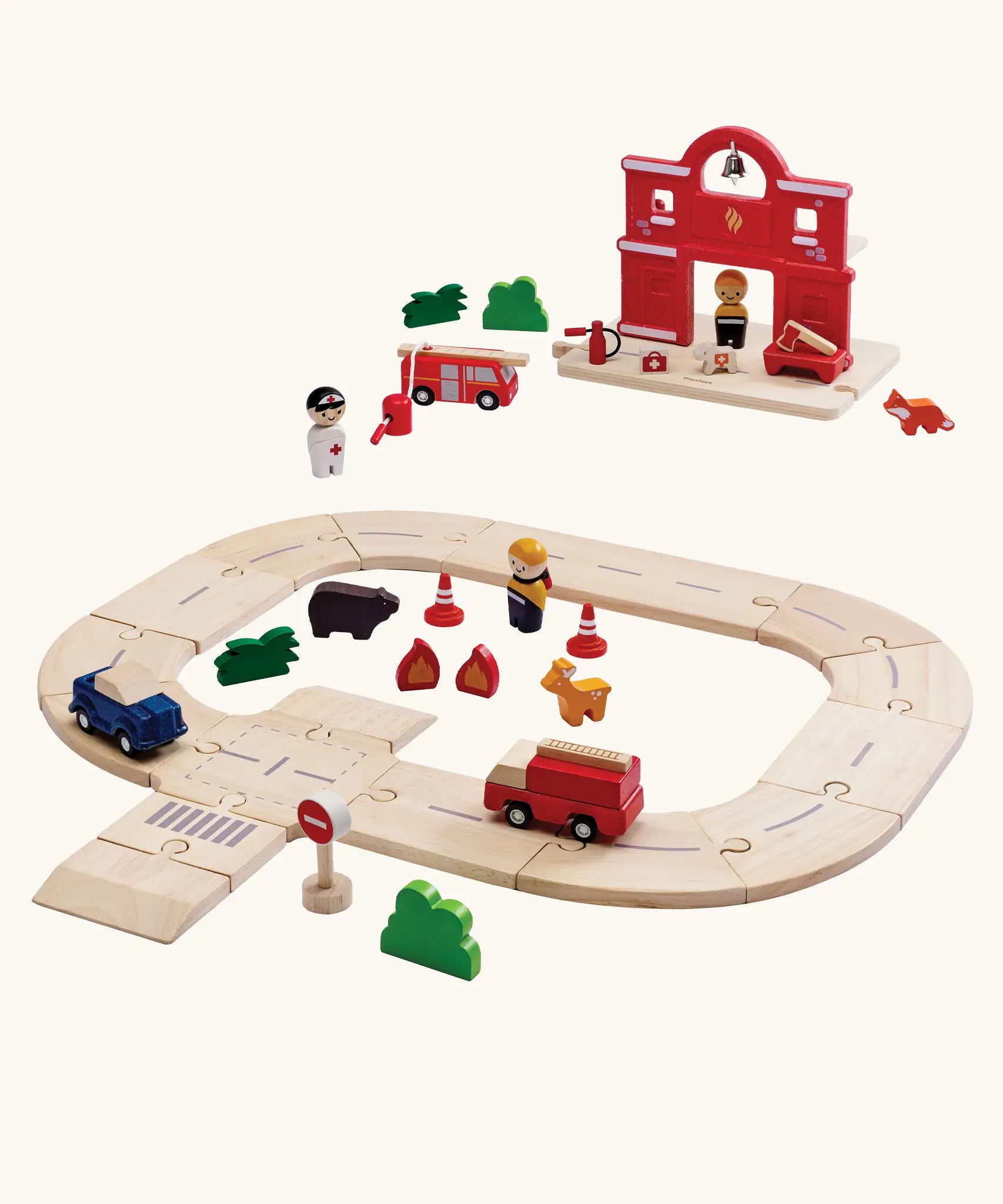PlanToys fire & rescue roadway set. Features wooden road pieces, emergency vehicles and figures and a fire station set