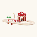 PlanToys road pieces connected to the fire station extension set