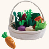 PlanToys basket with loose wooden veggies inside showing a loose carrot in  front
