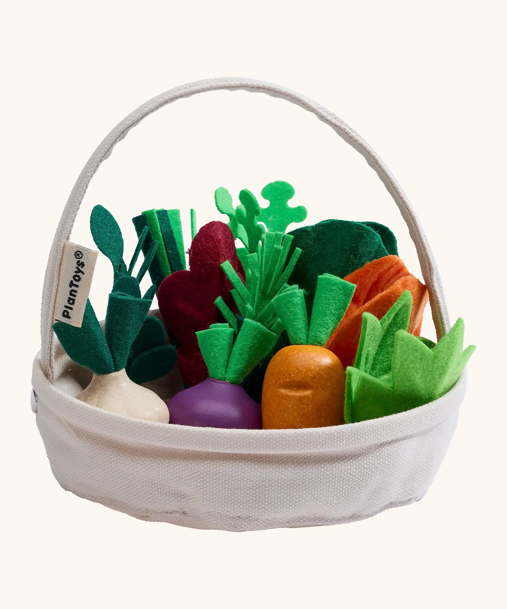 PlanToys basket with loose wooden veggies inside 