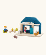 Back o  PlanToys wooden blue house set showing the included small furniture and figures