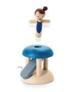 PlanToys wooden jumping gymnast. Showing a gymnast peg doll being launched 