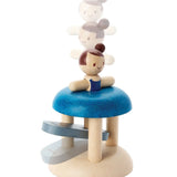 PlanToys wooden jumping gymnast. Showing a gymnast peg doll inserted in the base ready to be launched 