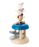 PlanToys wooden jumping gymnast. Showing a gymnast peg doll inserted in the base ready to be launched 
