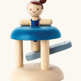 PlanToys wooden jumping gymnast. A interactive toy showing a gymnast peg doll slotted with a working base to launch the peg doll 