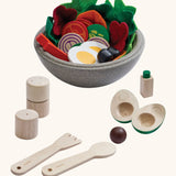 PlanToys little chef's salad set. Includes wooden playfood, cutlery and salt and pepper shakers