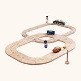PlanToys my first rail & road playset. Includes wooden road and rail pieces, train and cars and a wooden figure