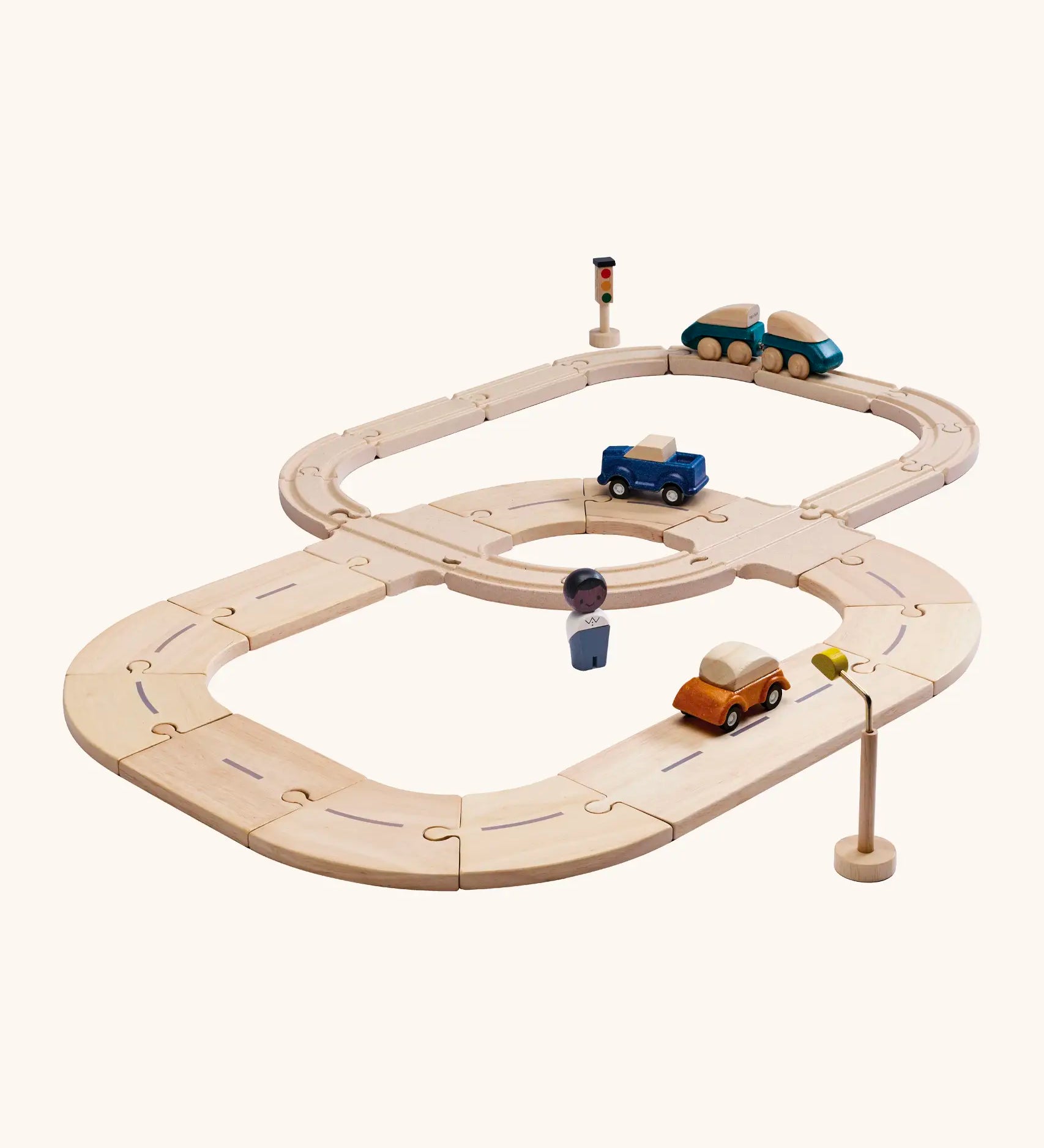 PlanToys my first rail & road playset. Includes wooden road and rail pieces, train and cars and a wooden figure