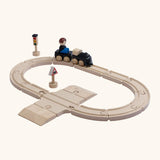 A PlanToys my first train set. Includes wooden rail pieces, train and carriage and rail signs