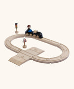 A PlanToys my first train set. Includes wooden rail pieces, train and carriage and rail signs