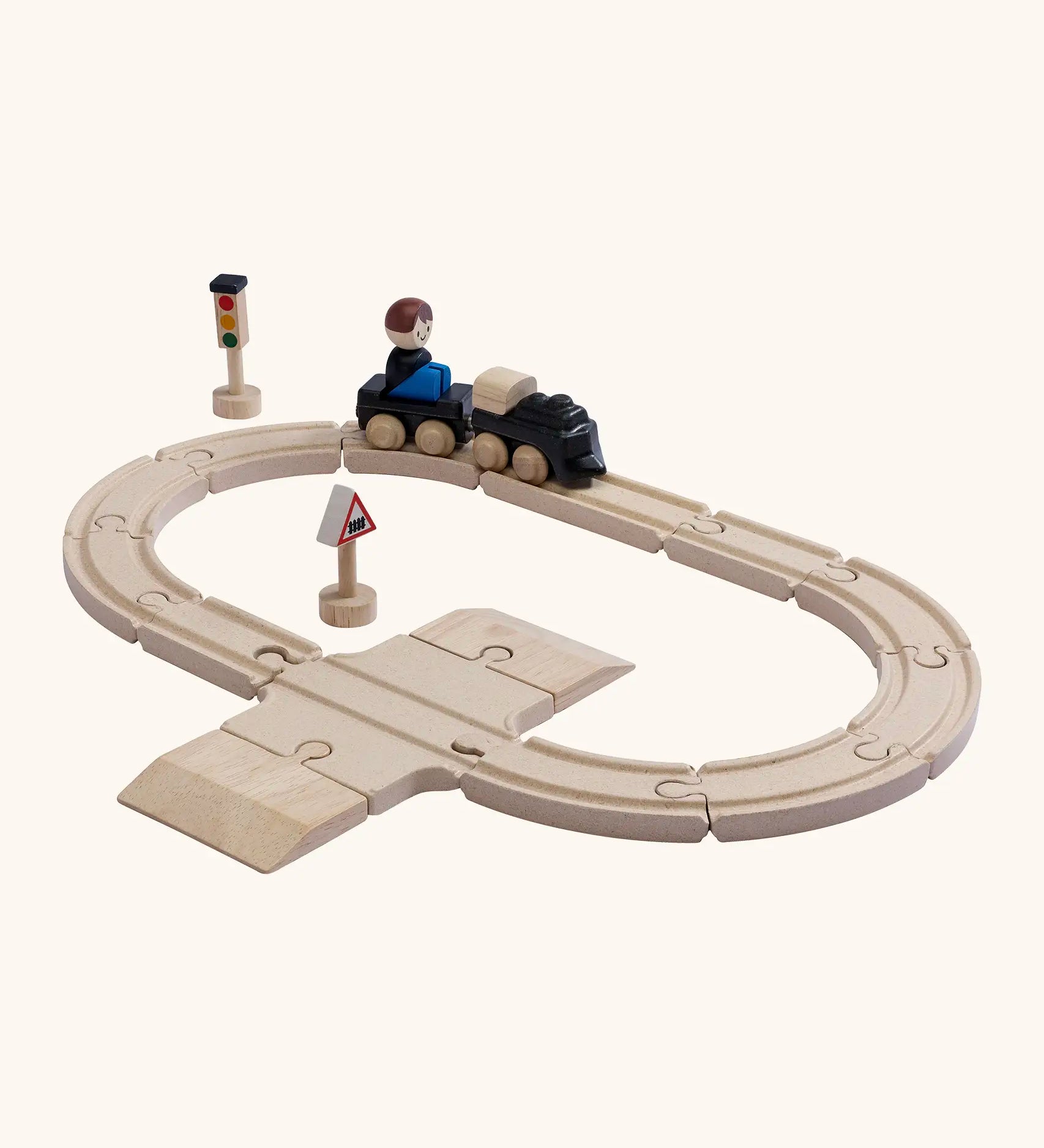 A PlanToys my first train set. Includes wooden rail pieces, train and carriage and rail signs