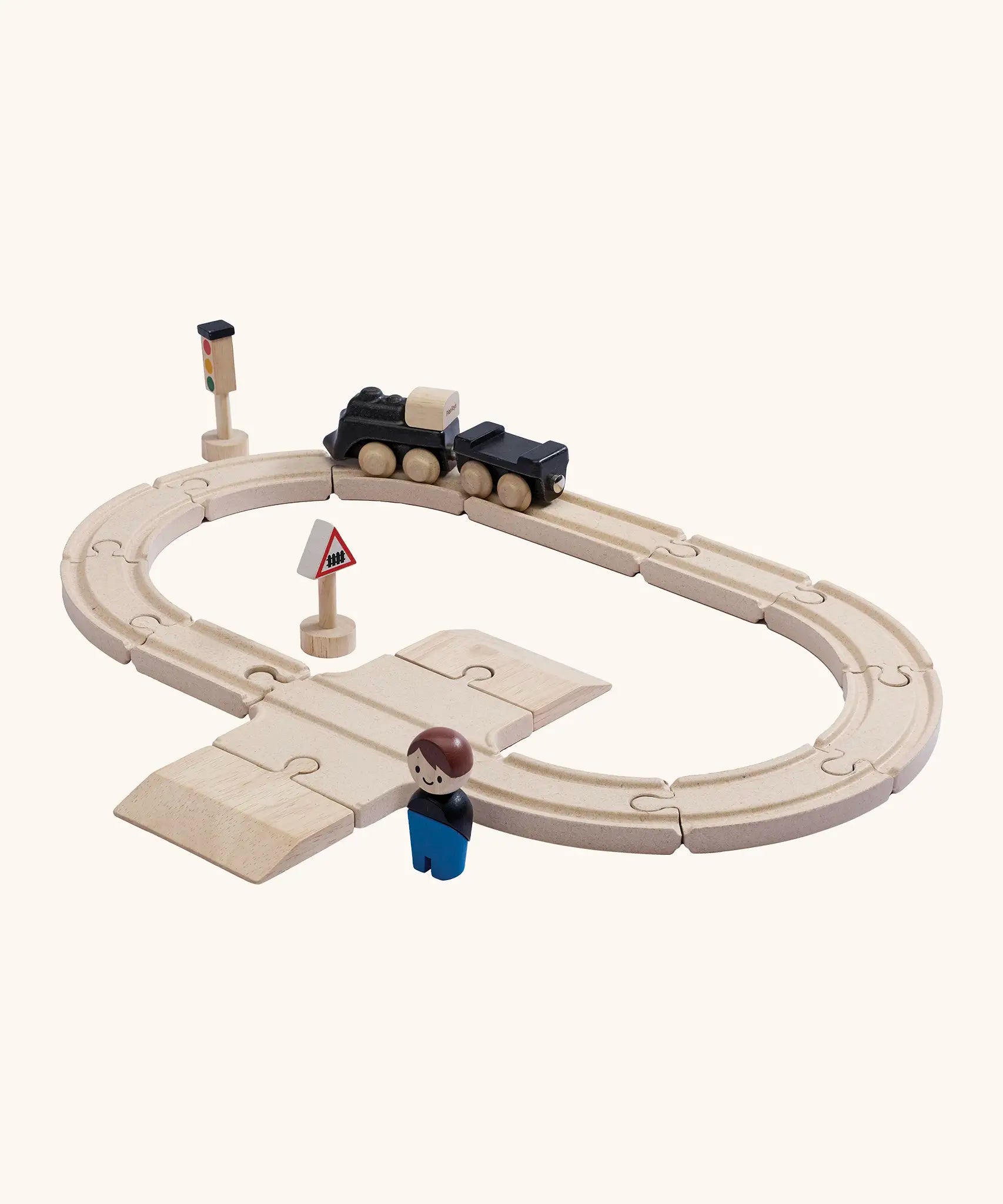 A PlanToys my first train set showing a train and carriage with a magnetic connector