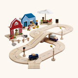 PlanToys my little neighbourhood roadway playset. Includes wooden road pieces, vehicles, market, home and a farm with small animal pieces