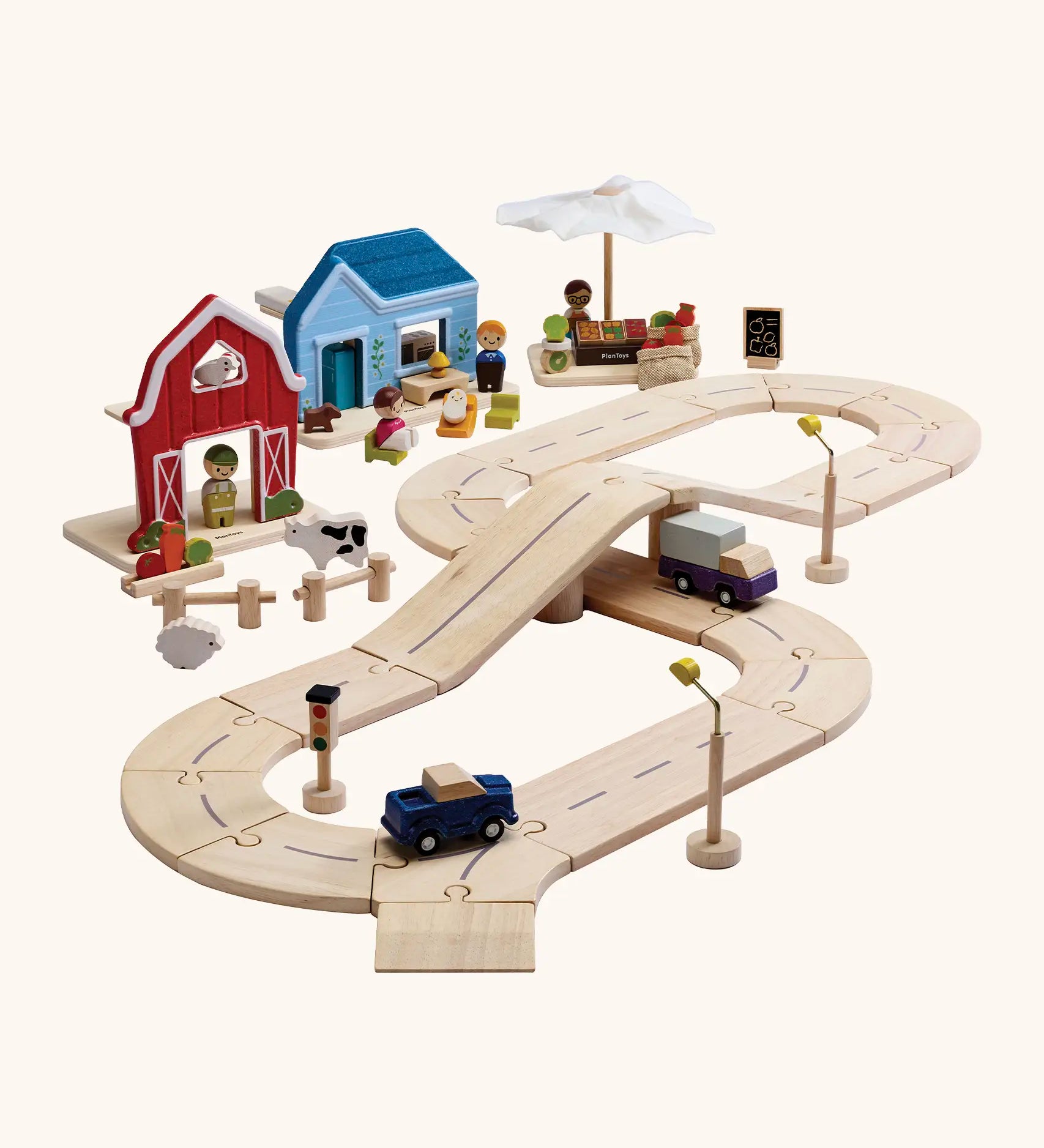 PlanToys my little neighbourhood roadway playset. Includes wooden road pieces, vehicles, market, home and a farm with small animal pieces