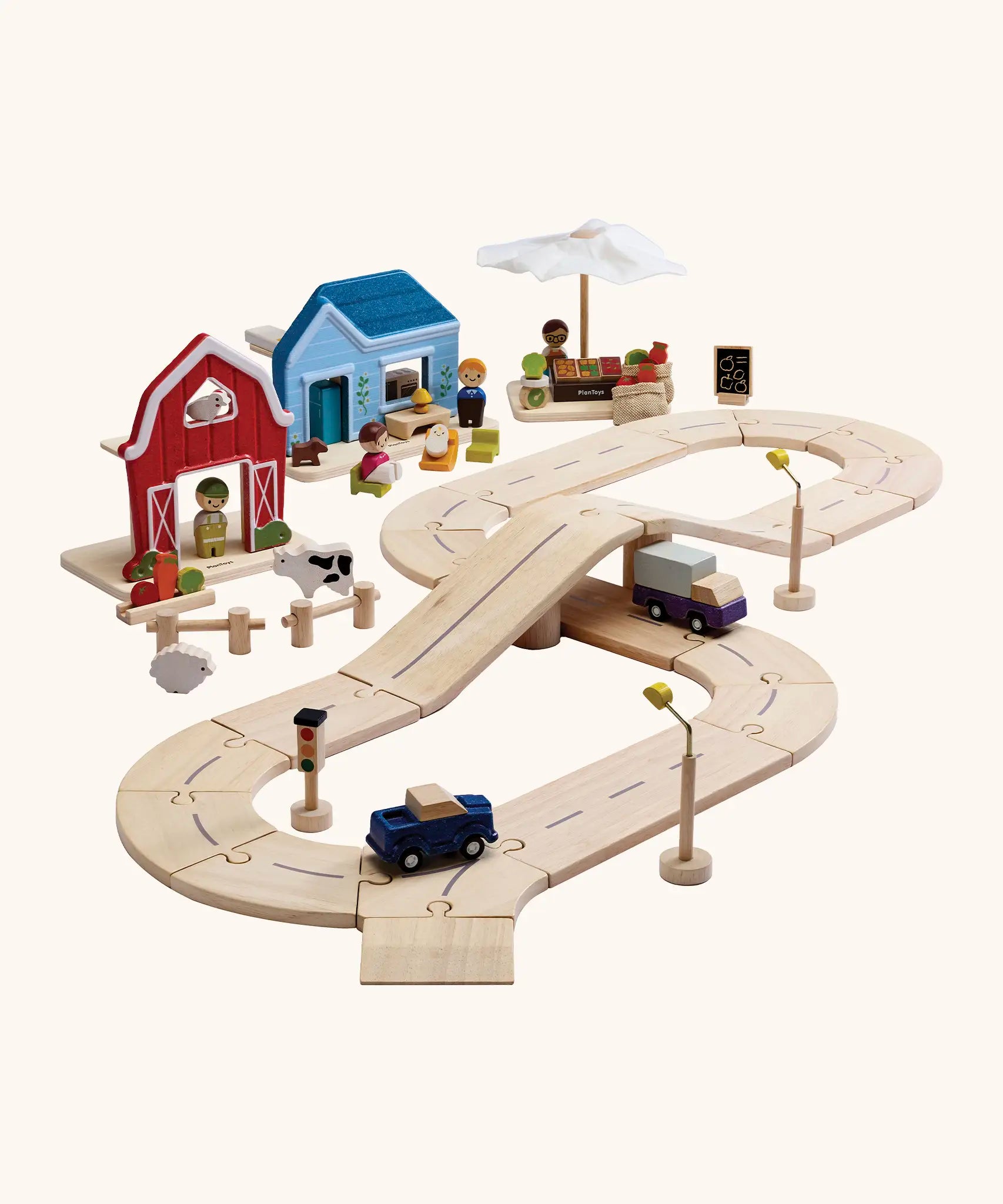 PlanToys my little neighbourhood roadway playset. Includes wooden road pieces, vehicles, market, home and a farm with small animal pieces