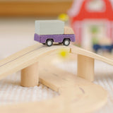 PlanToys wooden my little neighbourhood roadway playset showing a purple truck on a bridge