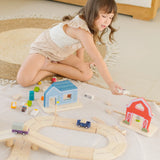 Child playing the farm pieces from the PlanToys my little wooden neighbourhood play set 